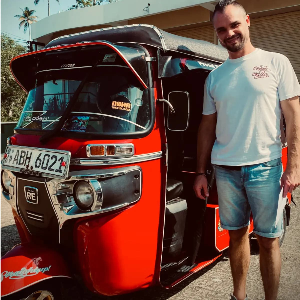 A traveller collecting their NOHA rental tuk tuk at handover in Galle
