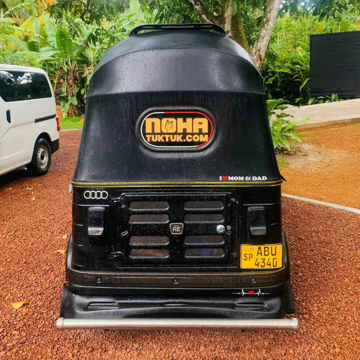 Rear view of a red NOHA self-drive rental tuk tuk in Sri Lanka