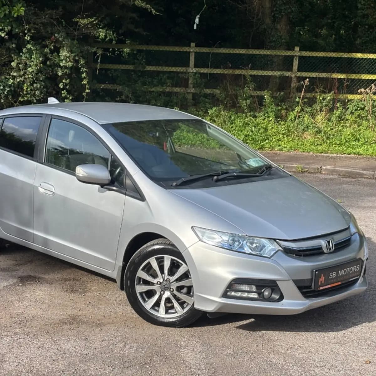 Exterior of a Honda Insight self-drive rental car from NOHA