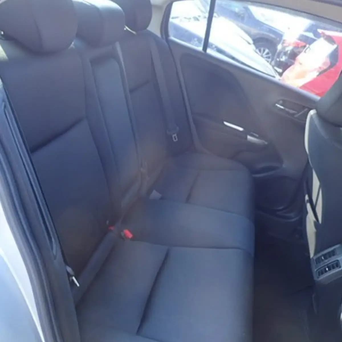Rear seats inside a Honda Grace self-drive rental car from NOHA