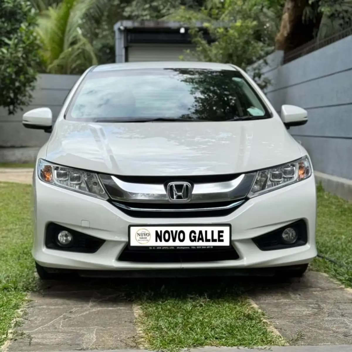 Exterior of a Honda Grace self-drive rental car from NOHA