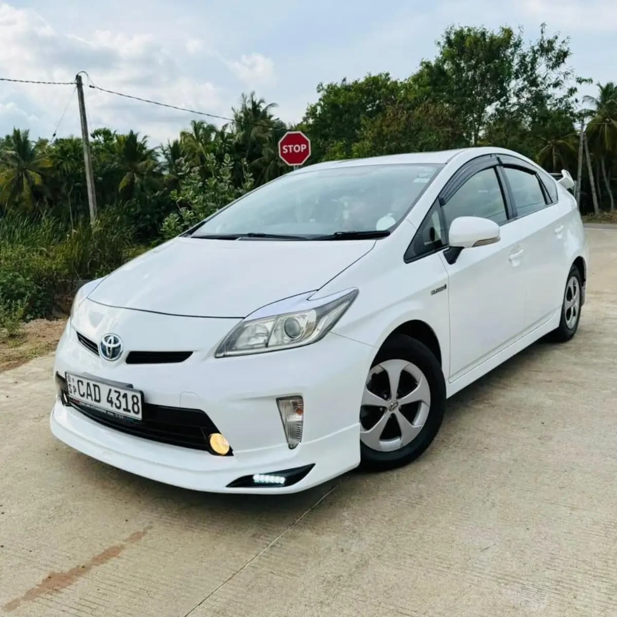 Exterior of a Toyota Prius hybrid self-drive rental car from NOHA