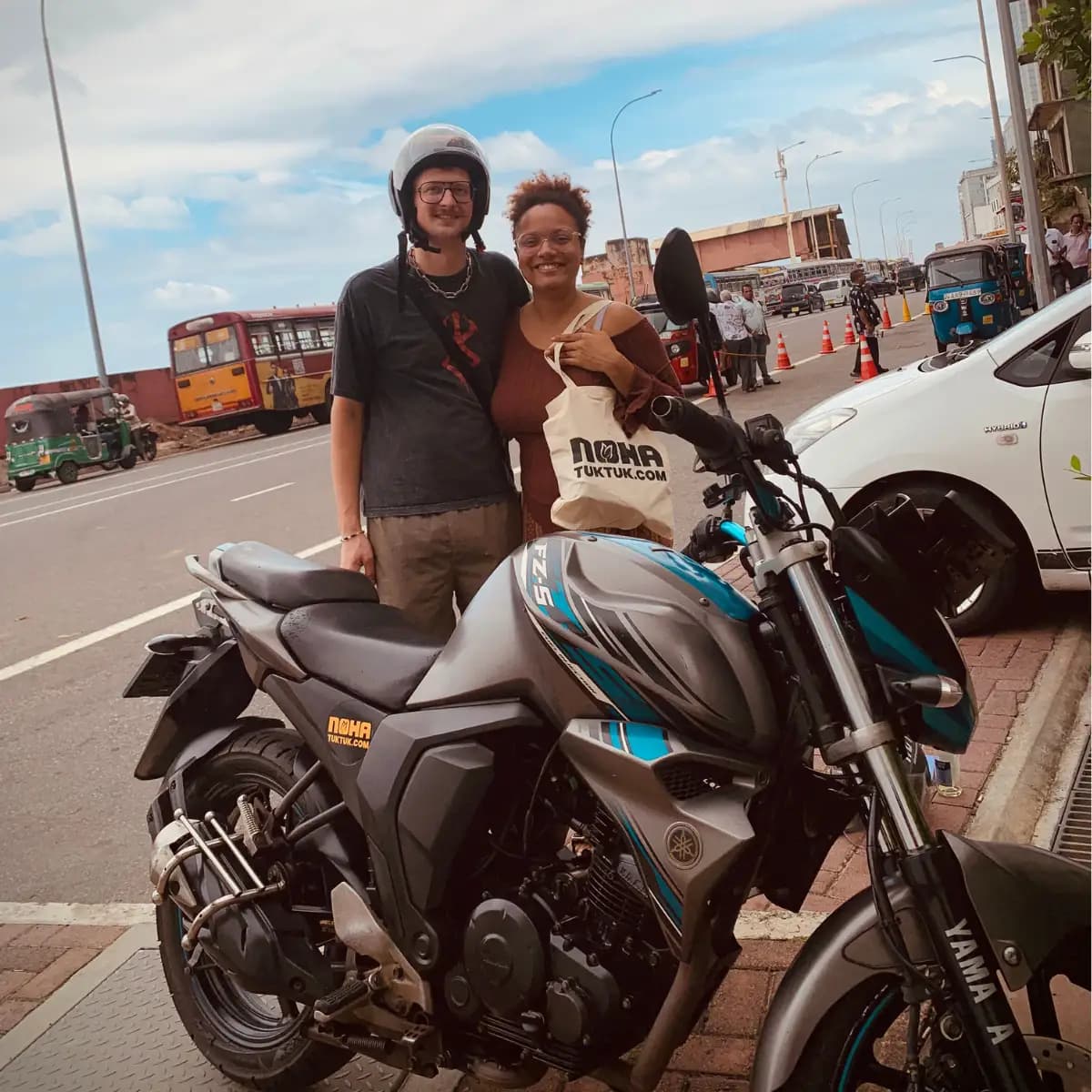 Travellers collecting a NOHA rental motorbike at handover