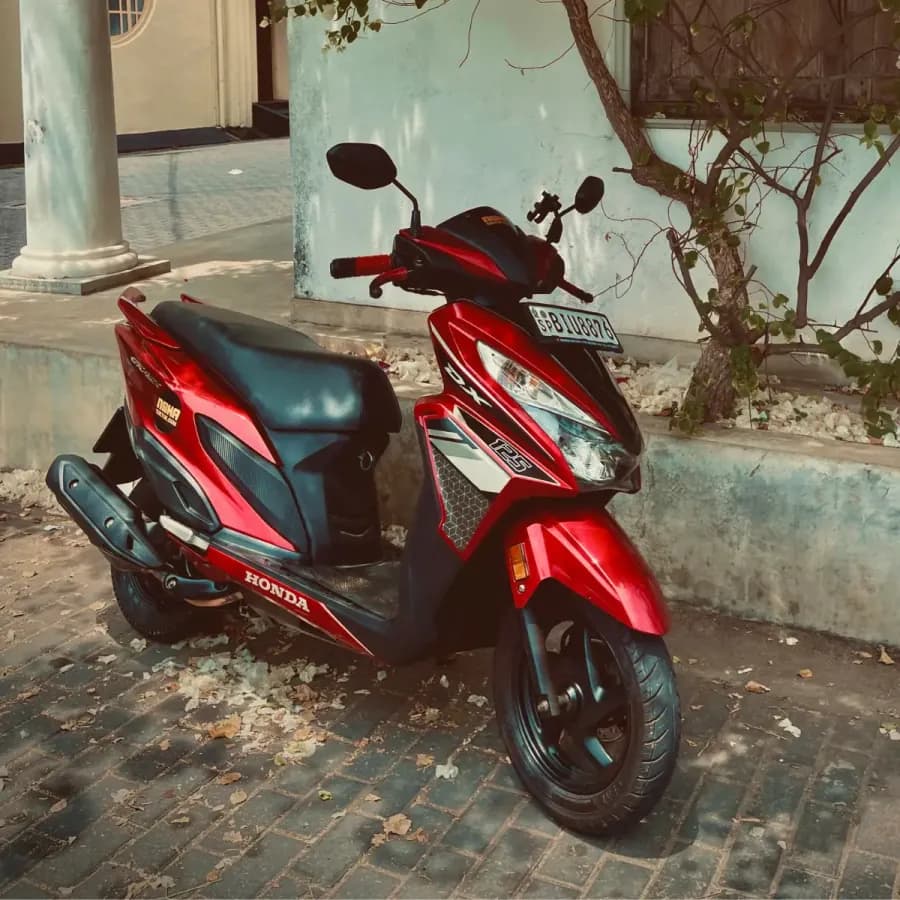 Three-quarter view of a NOHA self-drive rental scooter