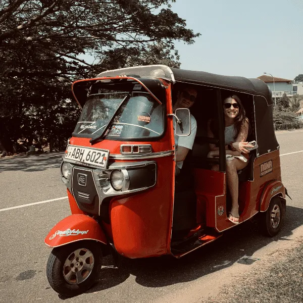 Bajaj tuk tuk parked on a road in Sri Lanka