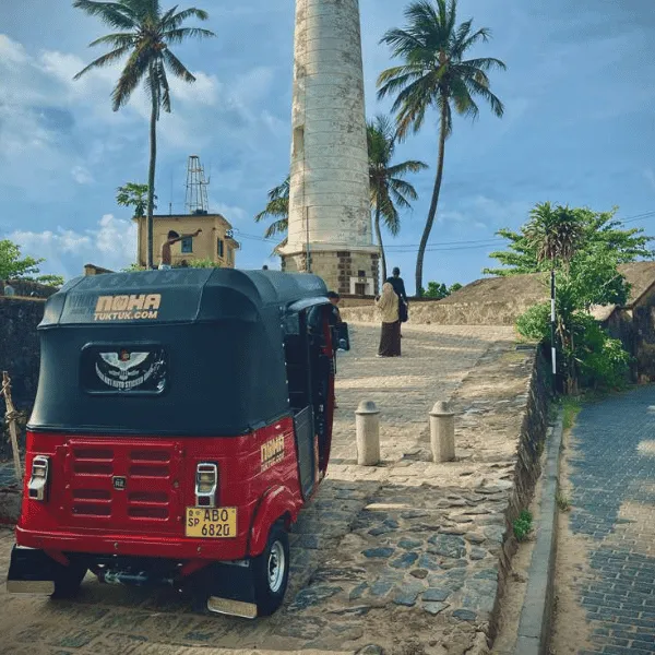 NOHA team handing over a tuk tuk to travellers in Galle